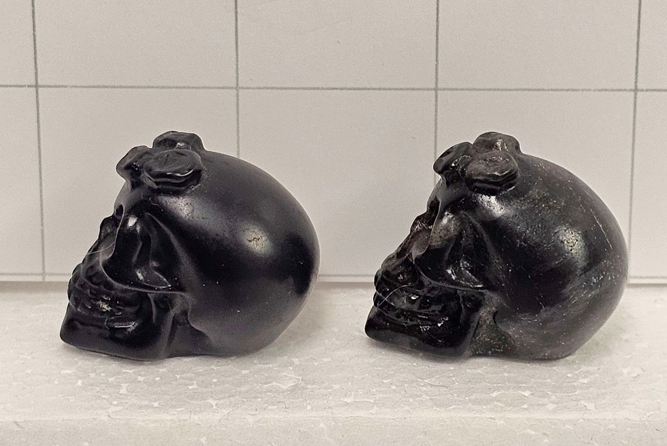 Obsidian carved Skulls with Flowers
